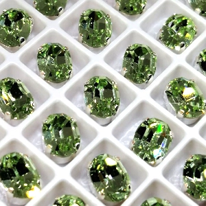 Страз в цапе 3022-125 Chrysolitte в серебряном цапе, овал 6х8 мм